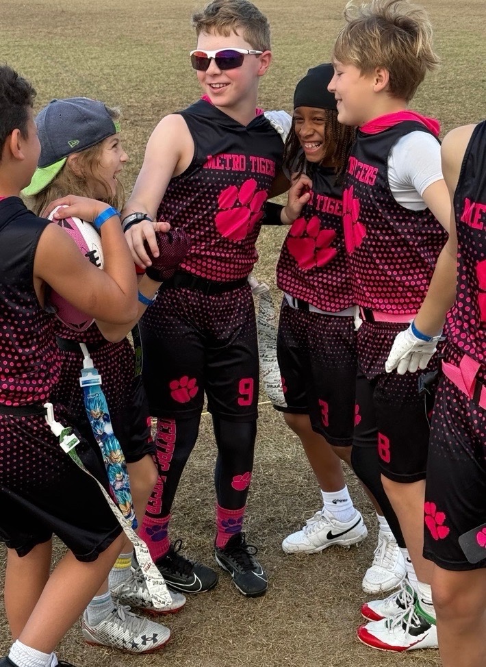 James Godfrey sharing a team moment with Metro Tigers teammates